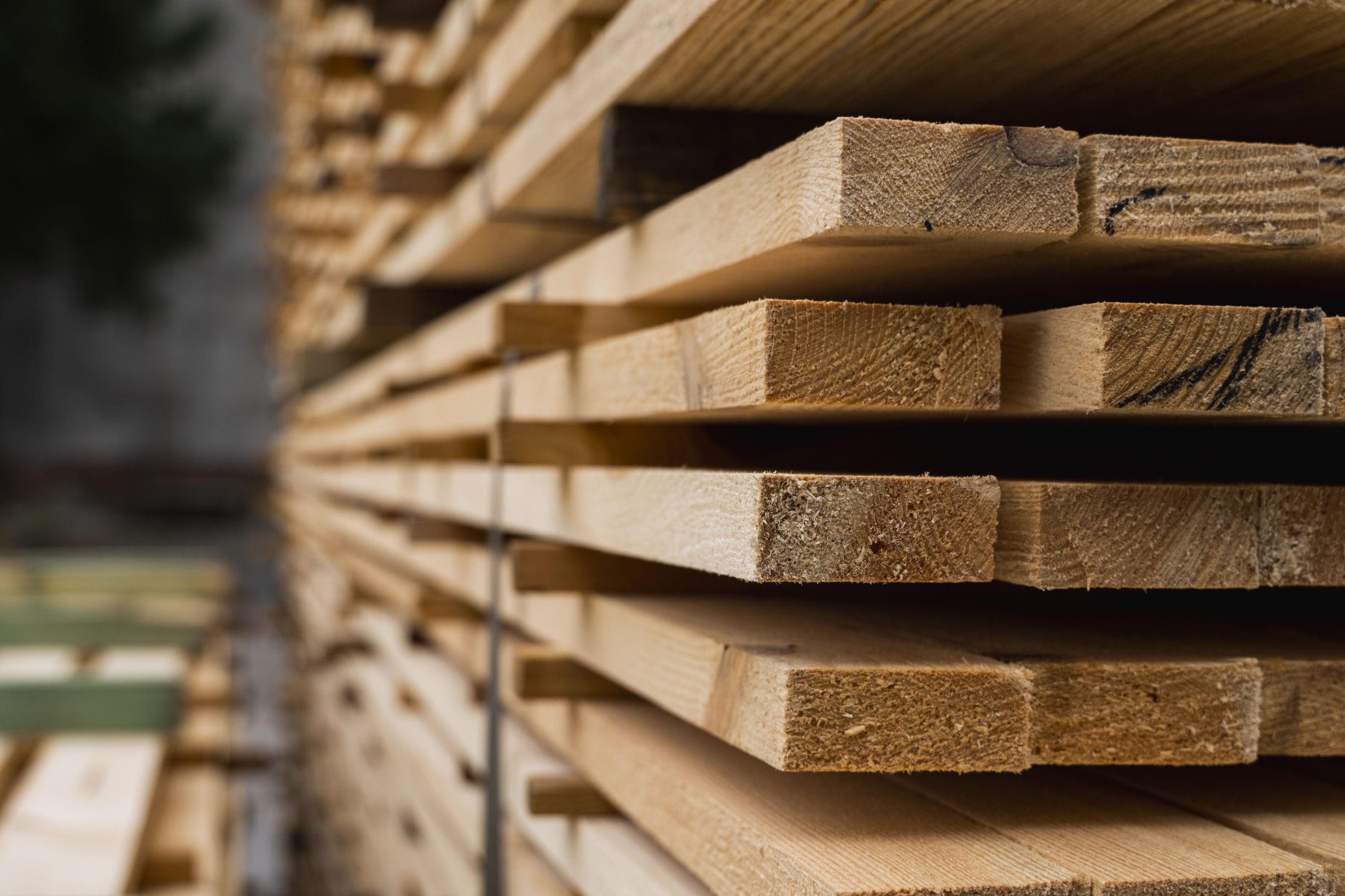 stacked lumber boards in a sawmill